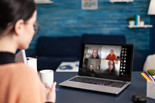 remote meeting laptop with colleagues